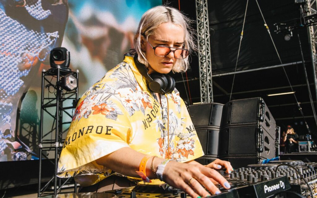 woman DJing at a festival